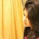 "Portrait of Sadia Malik, smiling in a professional setting.